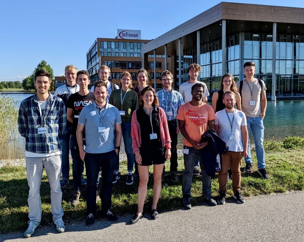 A group of people posing for a photo
Description automatically generated